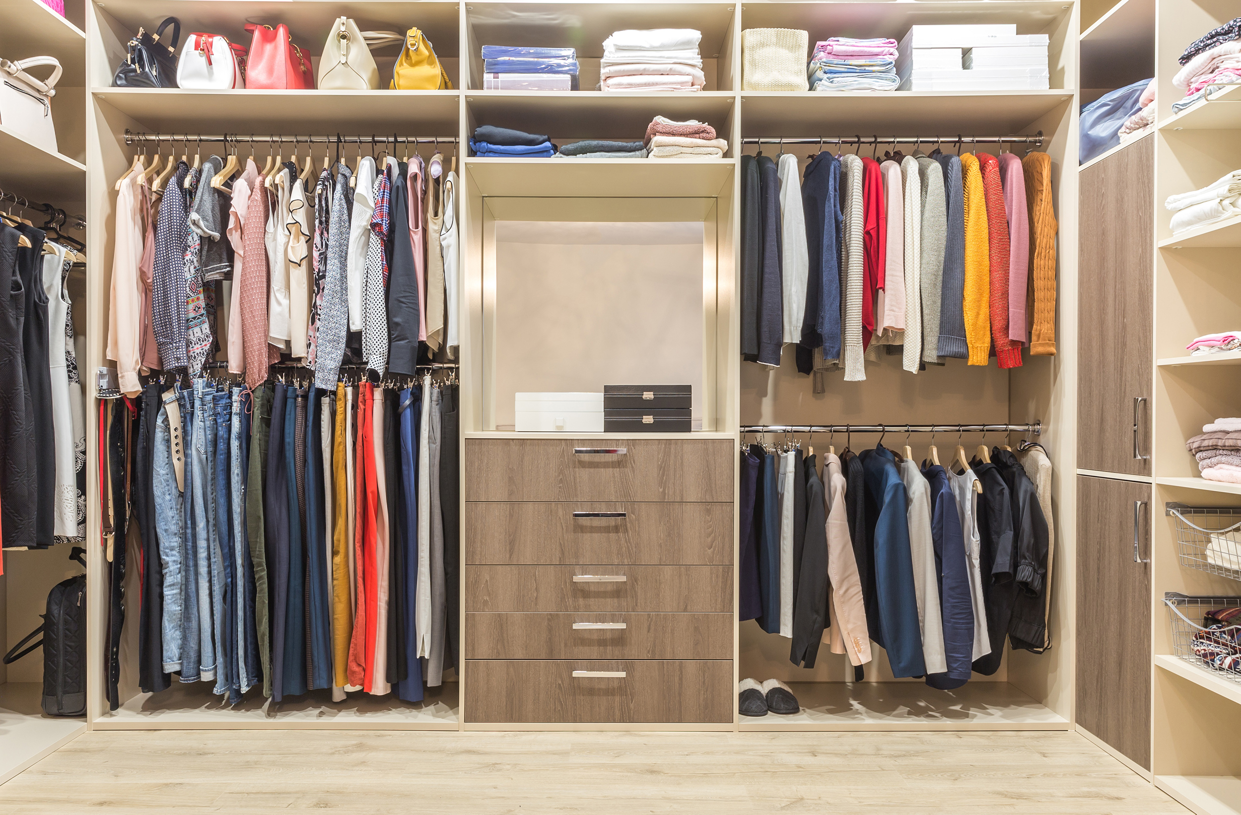 A tidy closet full of organized clothing